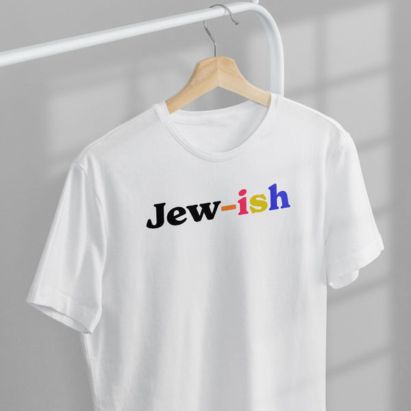 white t-shirt on a wooden hanger with a multicolored design that reads "jew-ish"